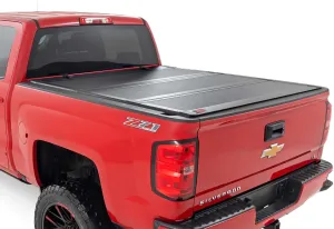 Rough Country Hard Tri-Fold Flip-Up Truck Bed Tonneau Cover for Chevy Silverado & GMC 1500/2500HD/3500HD (2014-2019) - Fits 6'7" (78.8-78.9") Bed with Rail Caps