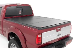 Rough Country Hard Tri-Fold Flip Up Truck Bed Tonneau Cover for Ford F-250/F-350 Super Duty (1999-2016) - Fits 6'10 (81.0-82.4") Bed, All-Weather, Flush Aluminum Panels